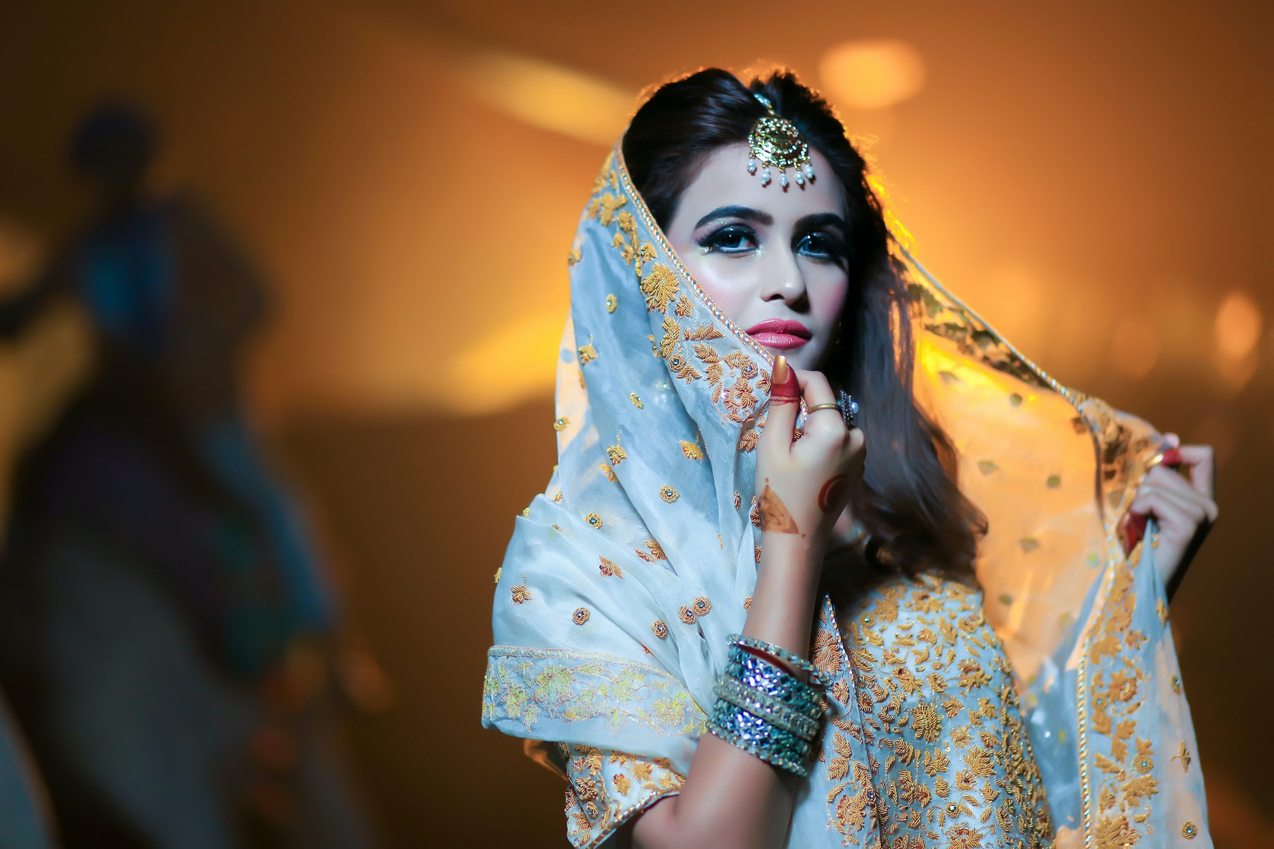 shallow-focus-photography-of-woman-wearing-blue-and-gold-1229414